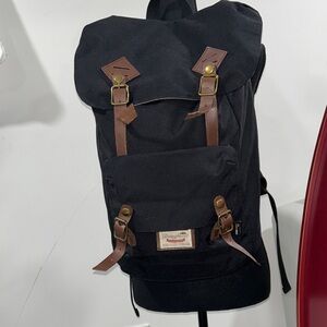 Rugged Black Backpack with Brown Straps
